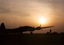 Sunset silhouette of a B_17 flying fortress